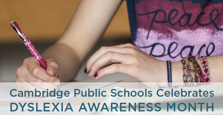 Image of teen girl's hands holding a pen, captioned: Cambridge Public Schools Celebrates Dyslexia Awareness Mongth